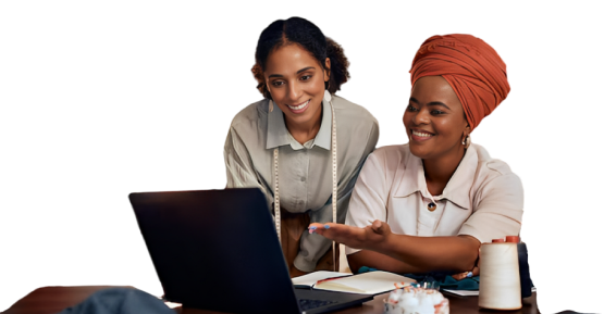 A picture of two African women shopping online on a laptop